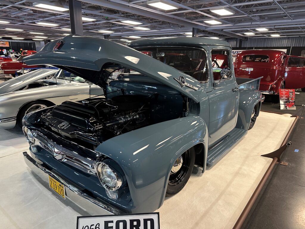Blue vintage pickup truck with hood open