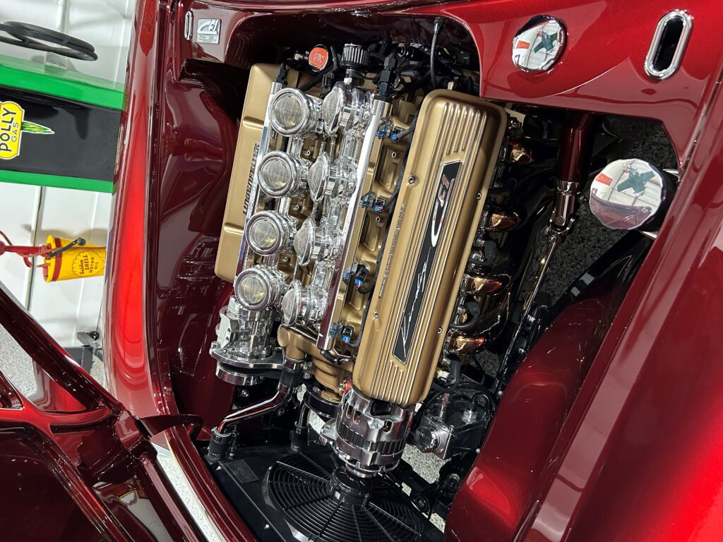 Shiny custom V8 engine in red hot rod